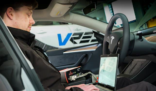 Cyber crime - car connected to a laptop
