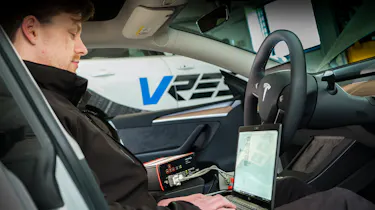Cyber crime - car connected to a laptop