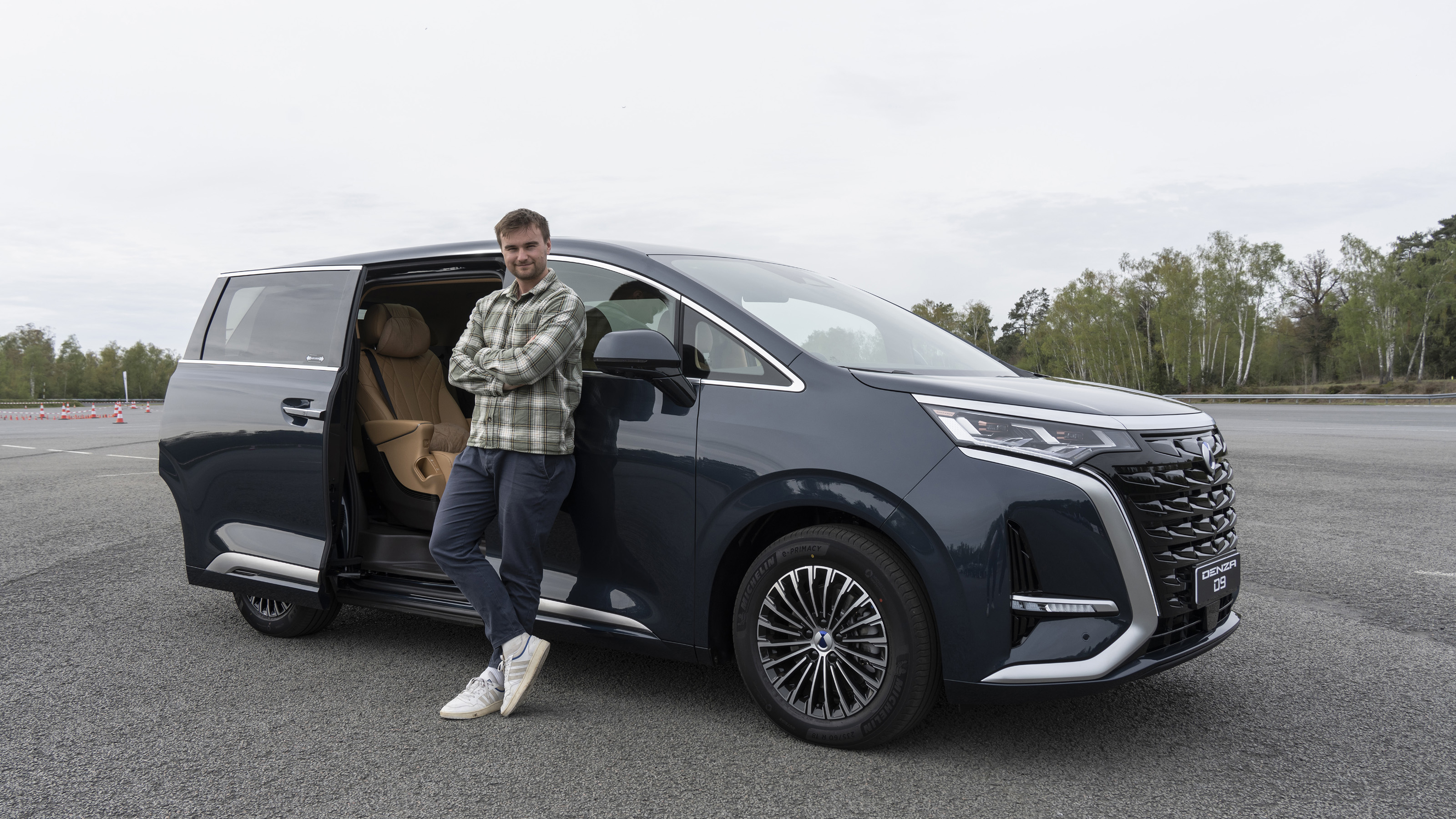 New Denza D9 - Auto Express senior news reporter Alastair Crooks stood next to the Denza D9, front static