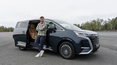 New Denza D9 - Auto Express senior news reporter Alastair Crooks stood next to the Denza D9, front static