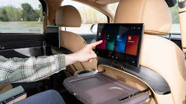 New Denza D9 - Auto Express senior news reporter Alastair Crooks using the rear infotainment screen