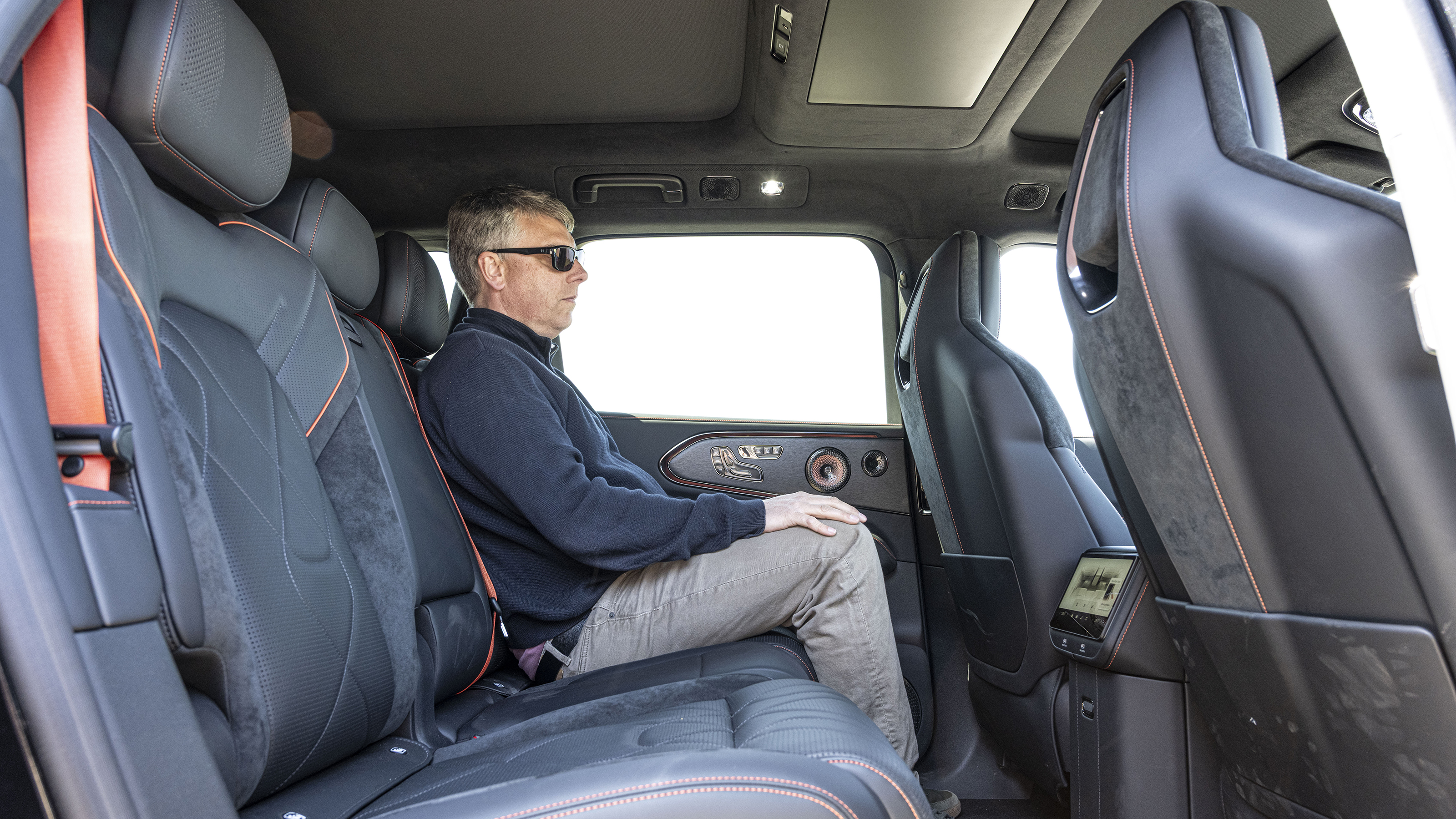 New Zeekr 8X plug-in hybrid - rear seats being sat in by Auto Express editor Paul Barker 