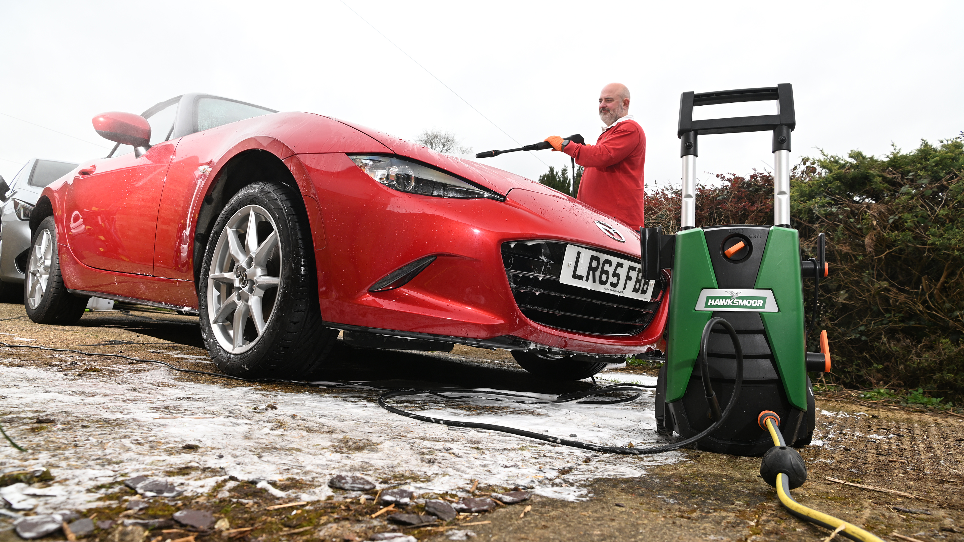 Auto Express Product Awards 2026 - products editor Tom Barnard washing his car using the Hawksmore pressure washer