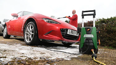 Auto Express Product Awards 2026 - products editor Tom Barnard washing his car using the Hawksmore pressure washer