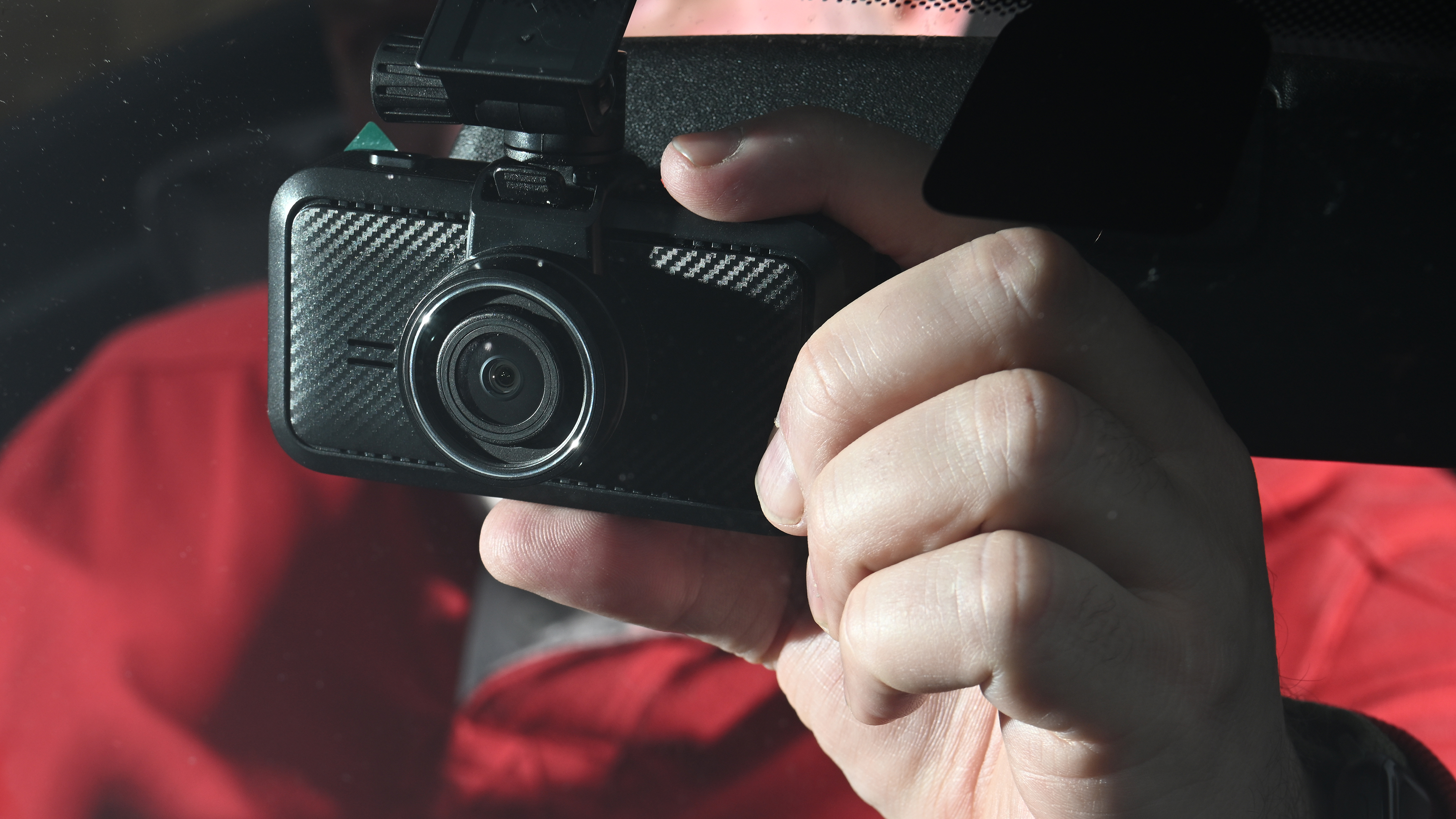 Auto Express Product Awards 2026 - products editor Tom Barnard fitting the Miofive S1 dash cam