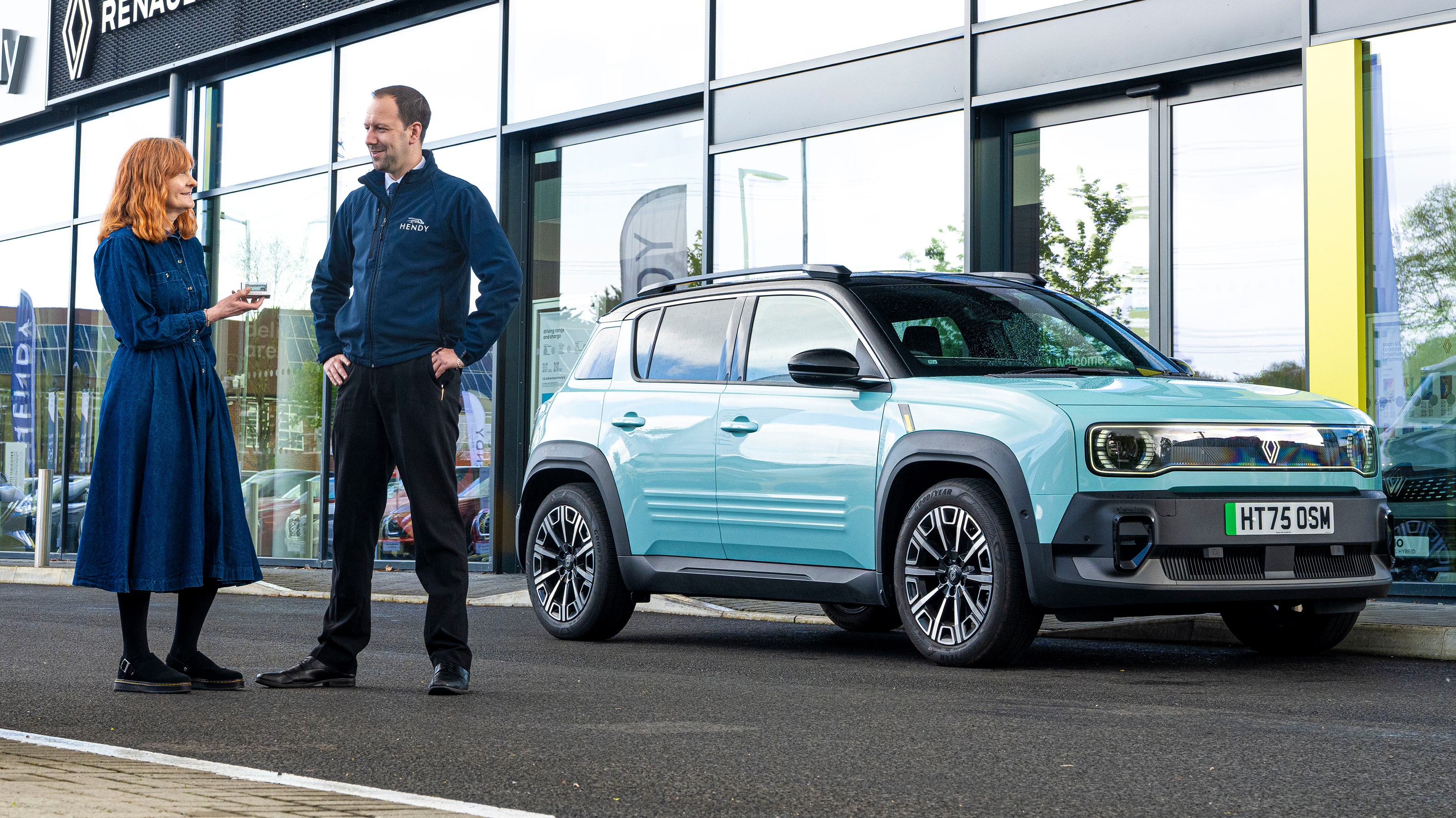 Auto Express pictures editor Dawn Grant and Renault sales executive Jamie Collis standing next to the Renault 4