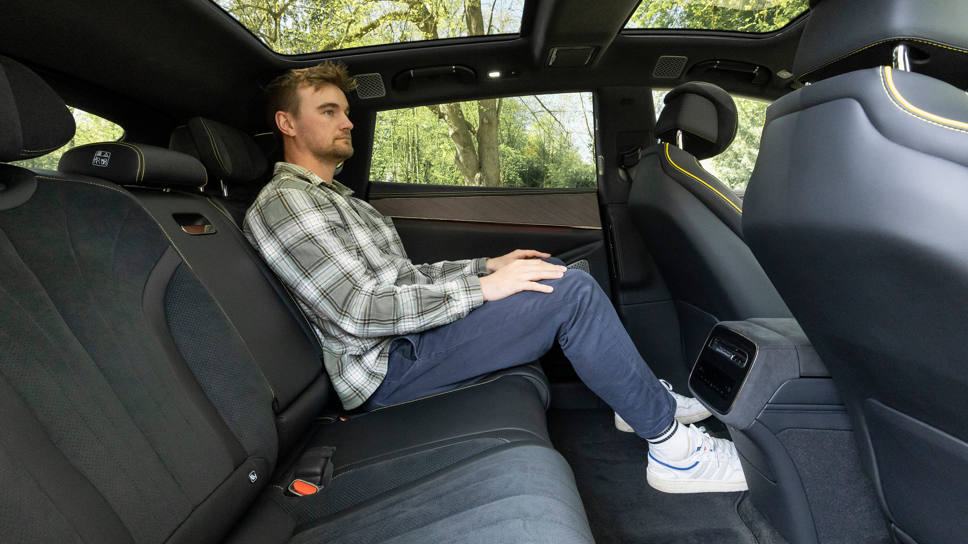 Auto Express senior news reporter Alastair Crooks sitting in the Denza Z9GT EV's rear seat