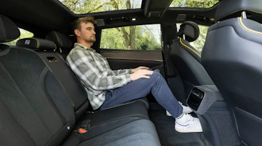 Auto Express senior news reporter Alastair Crooks sitting in the Denza Z9GT EV's rear seat
