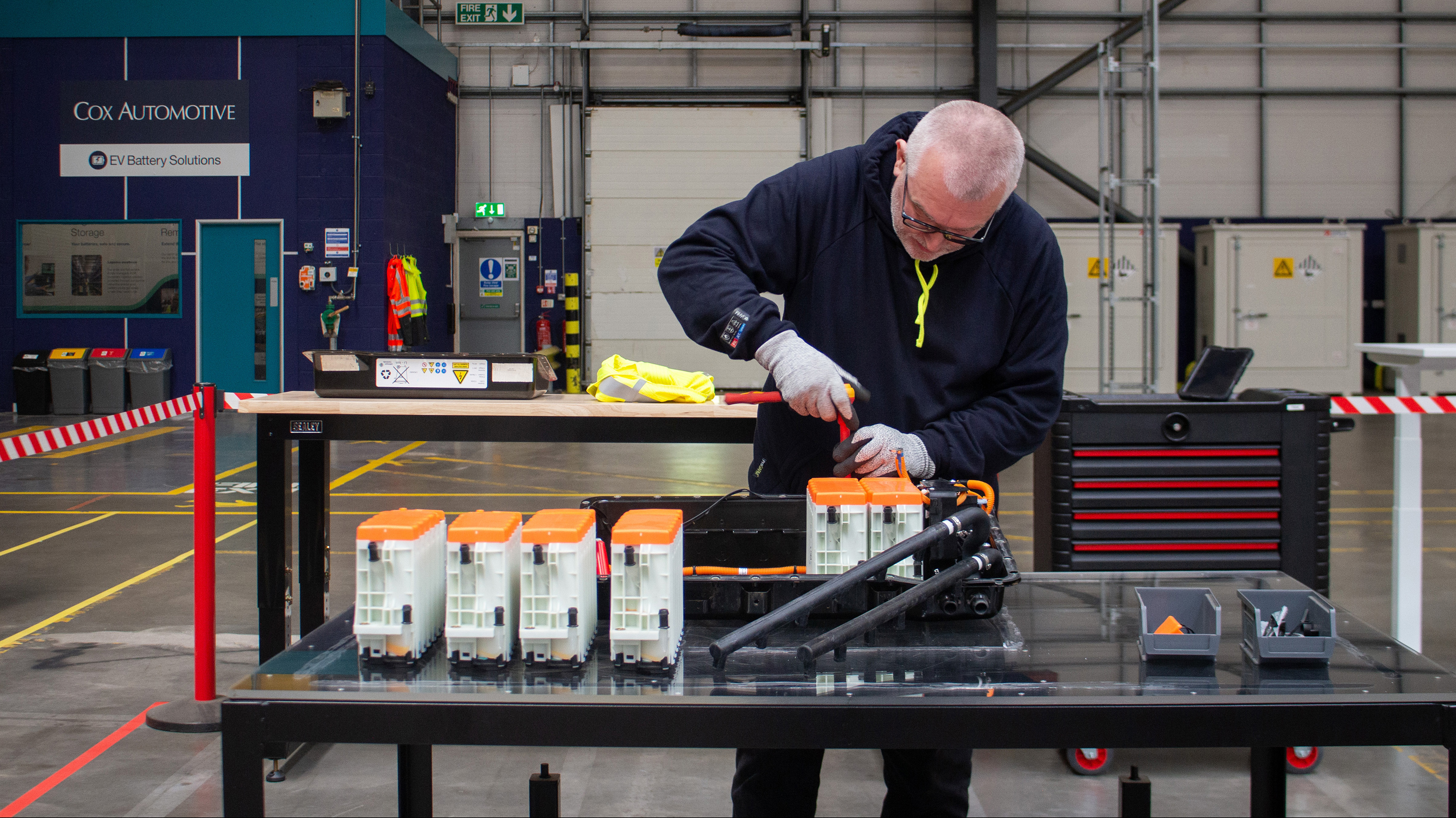 Technician working on EV batteries