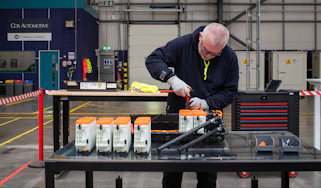 Technician working on EV batteries