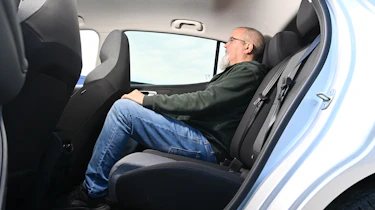 Auto Express senior test editor Dean Gibson sitting in the MG4 Urban's rear seat