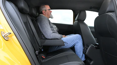 New Volkswagen T-Roc 2026 - rear interior, car being sat in by Auto Express senior test editor Dean Gibson