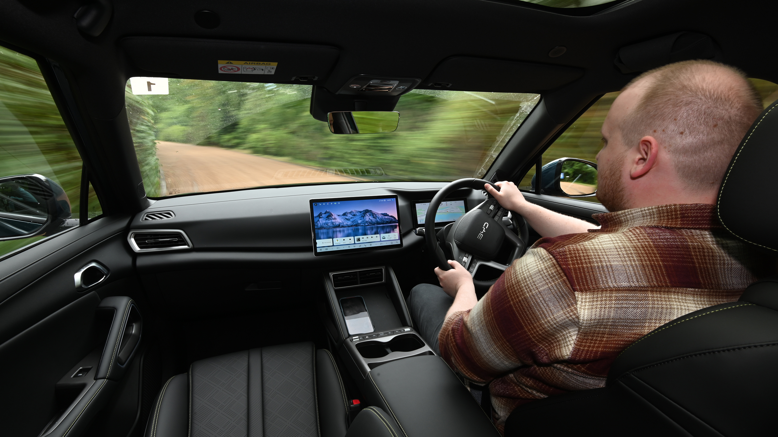 Auto Express news reporter Ellis Hyde driving the BYD Atto 2 DM-i