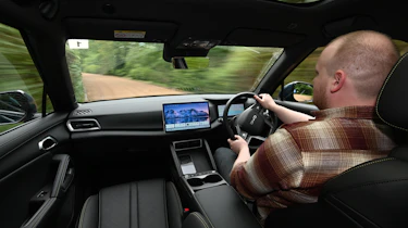 Auto Express news reporter Ellis Hyde driving the BYD Atto 2 DM-i