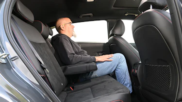 Auto Express senior test editor Dean Gibson sitting in the Hyundai Kona Hybrid's rear seat