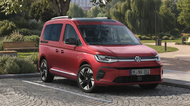 Volkswagen Caddy van - rear front 3/4