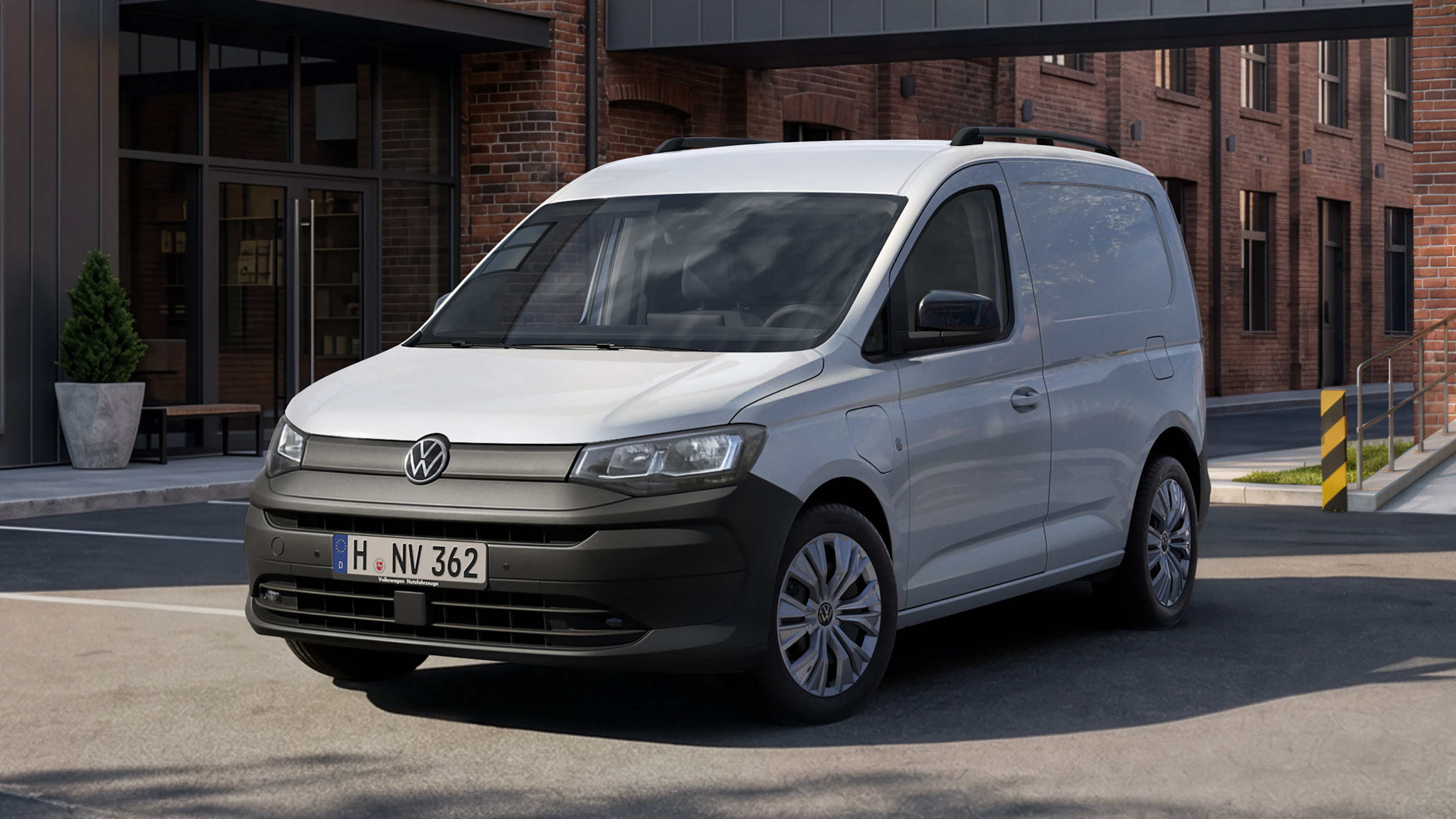 Volkswagen Caddy van - white front 3/4