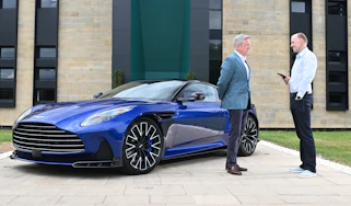 Aston CEO Adrian Hallmark talking to Phil McNamara next to a Vanquish