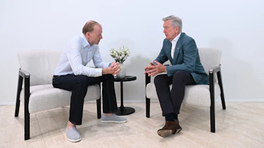 Aston CEO Adrian Hallmark talking to Phil McNamara white room