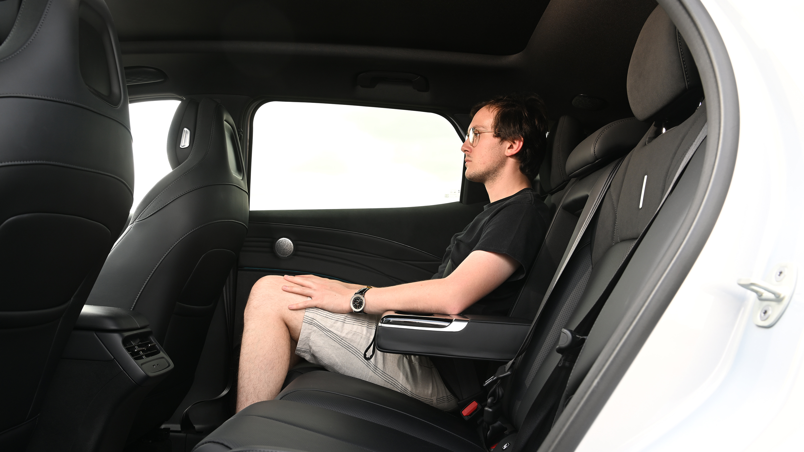 Auto Express consumer editor Tom Jervis sitting in the Omoda 7 SHS-P Noble Tech's rear seat