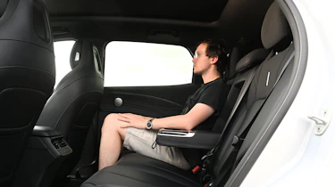 Auto Express consumer editor Tom Jervis sitting in the Omoda 7 SHS-P Noble Tech's rear seat