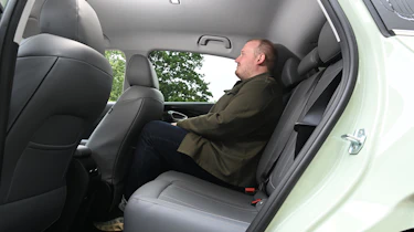 New Geely EX2 - rear seats being sat in by Auto Express news reporter Ellis Hyde