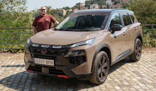 Auto Express news repoter Ellis Hyde standing next to the Nissan X-Trail