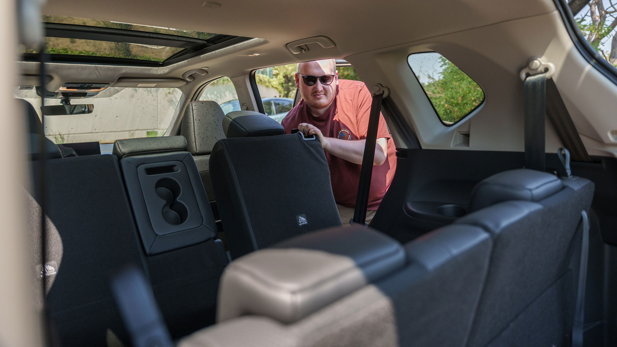 Auto Express news reporter folding the Nissan X-Trail's mid-row seats