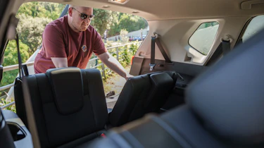 Auto Express news reporter Ellis Hyde folding the Nissan X-Trail's rearmost seats
