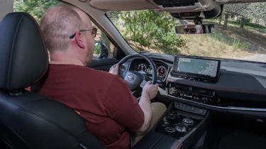 Auto Express news reporter Ellis Hyde driving the Nissan X-Trail