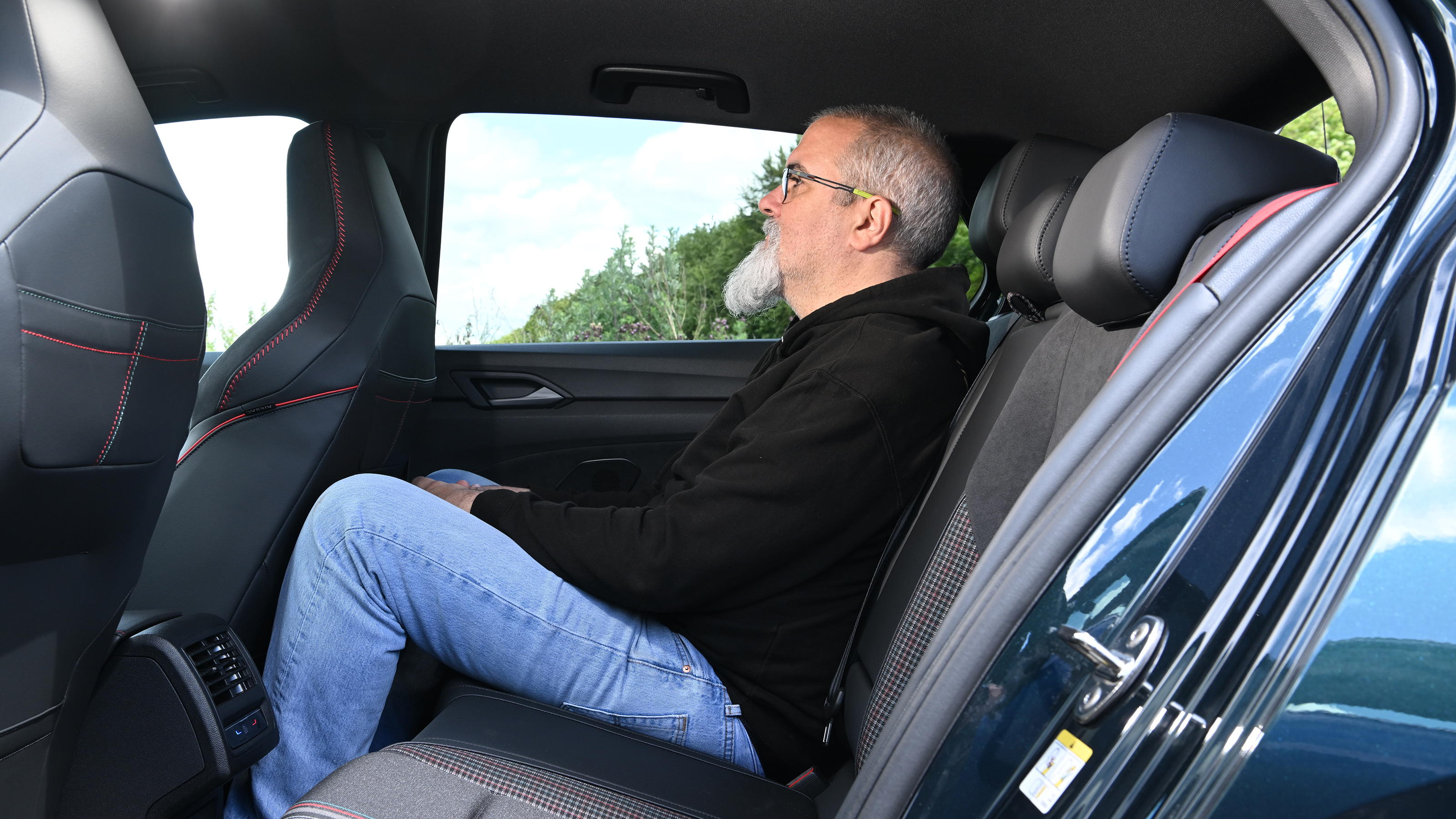 Volkswagen Golf GTI Edition 50 being driven in the UK - rear seats being sat in by Auto Express senior test editor Dean Gibson 