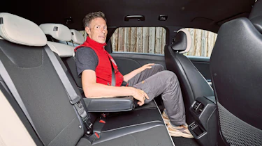 Holger Preiss sitting in the Kia K4 Sportswagon's rear seat