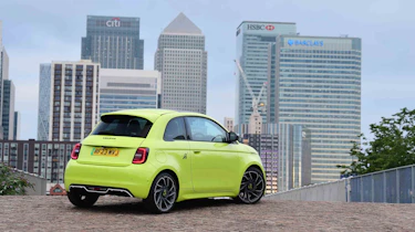Abarth 500e - rear static, city background