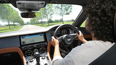 Auto Express news editor Jordan Katsianis driving theBentley Continental GT