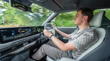 Kia EV2 Long Range - front interior, car being driven by Auto Express consumer reporter Tom Jervis