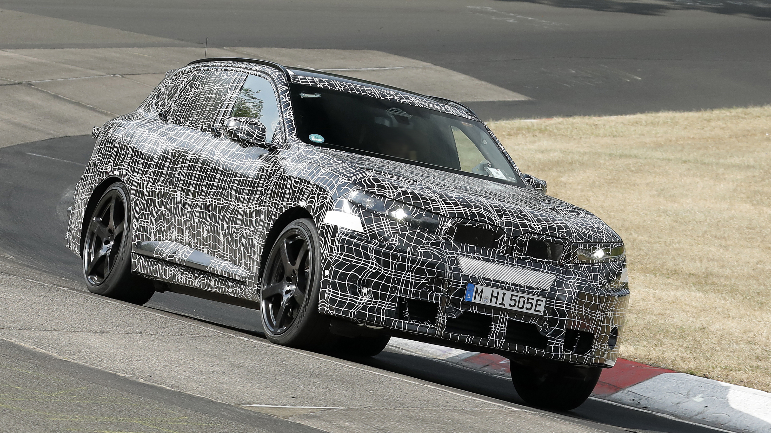 New BMW iX5 M at the Nurburgring - front cornering 