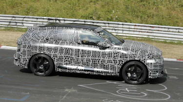 New BMW iX5 M at the Nurburgring - side action