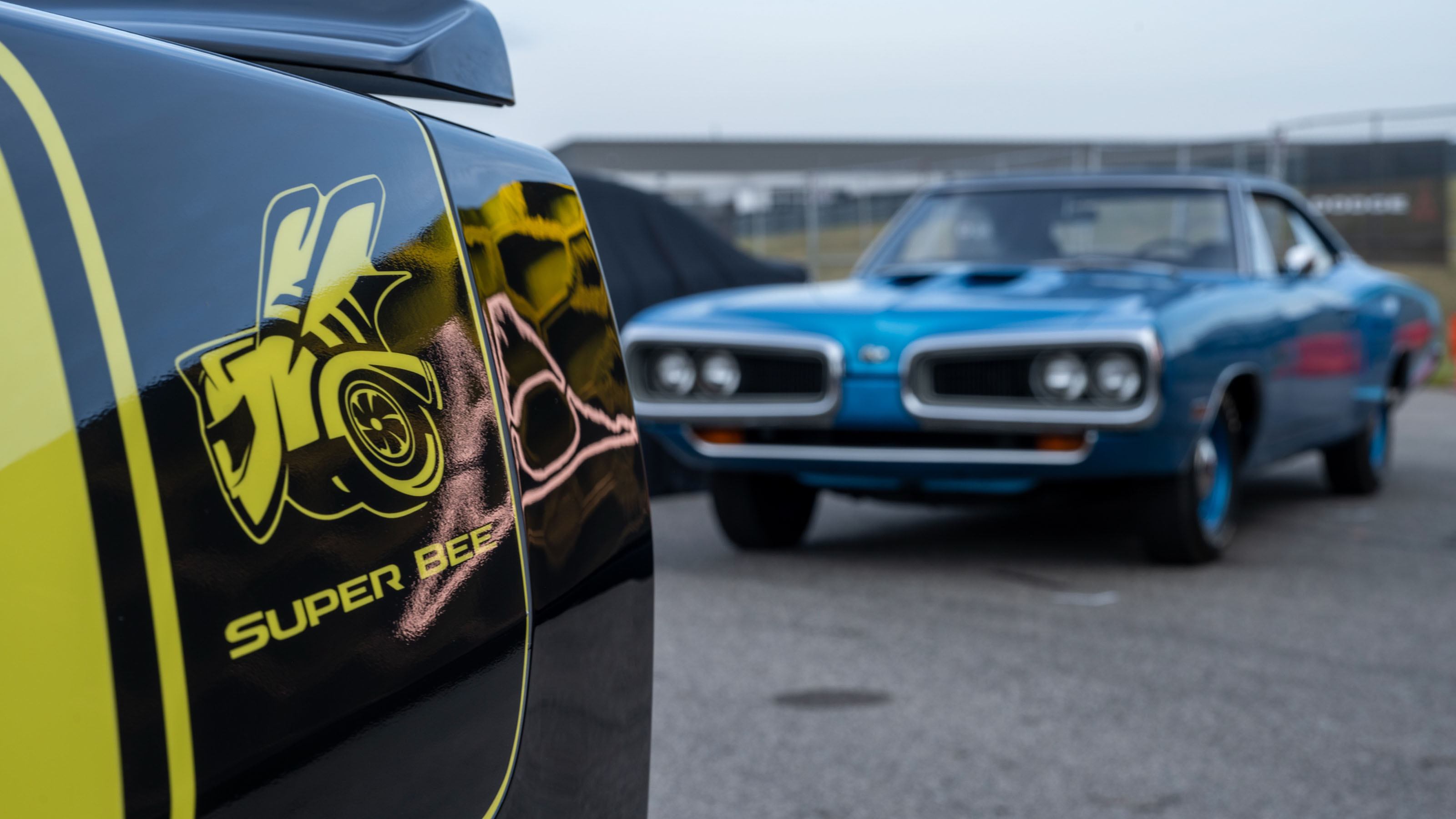 New Dodge Charger Super Bee Launch Edition - rear with classic Super Bee in the background