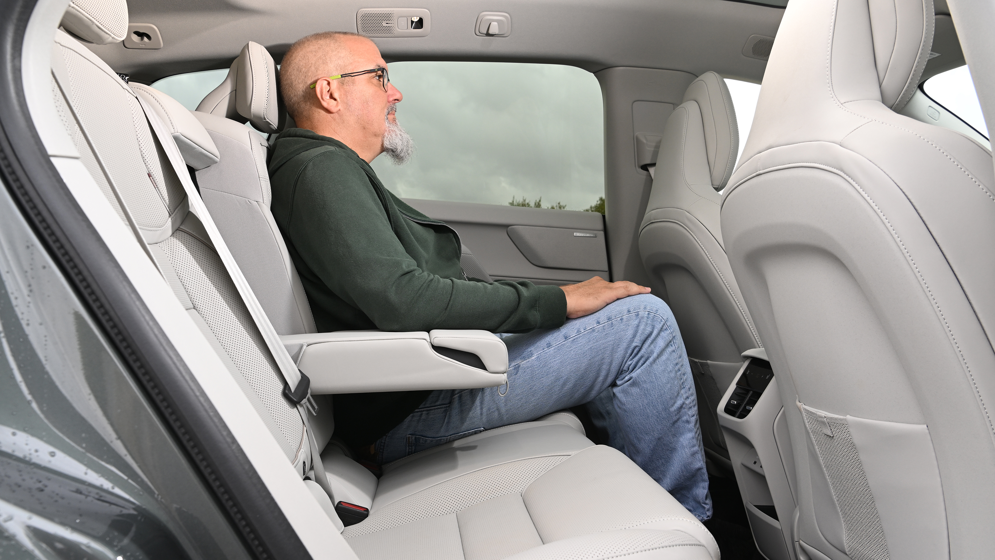 Volvo EX60 2026 - rear seats being sat in by Auto Express senior test editor Dean Gibson 