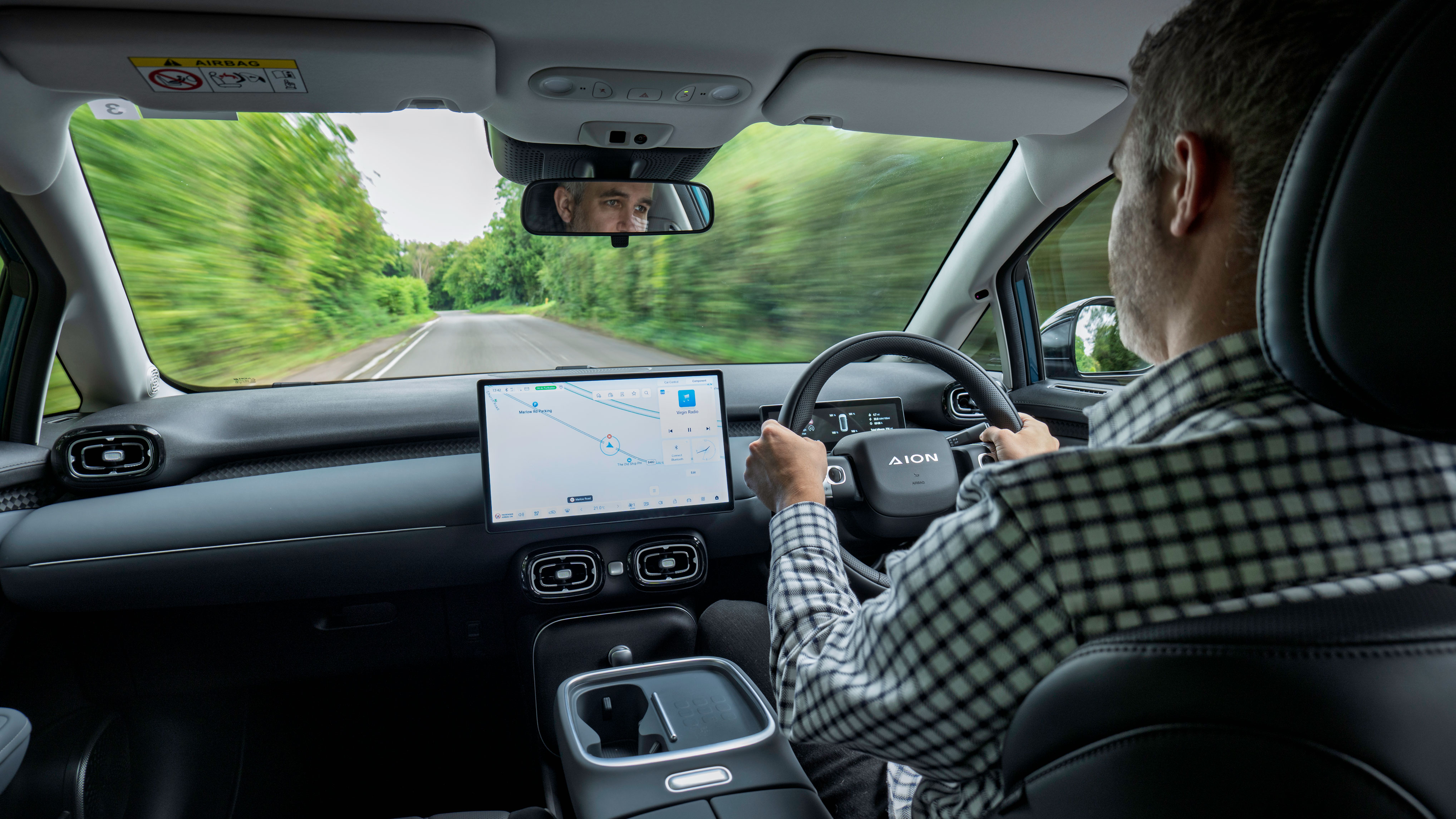 Richard Ingram driving the Aion UT