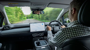 Richard Ingram driving the Aion UT