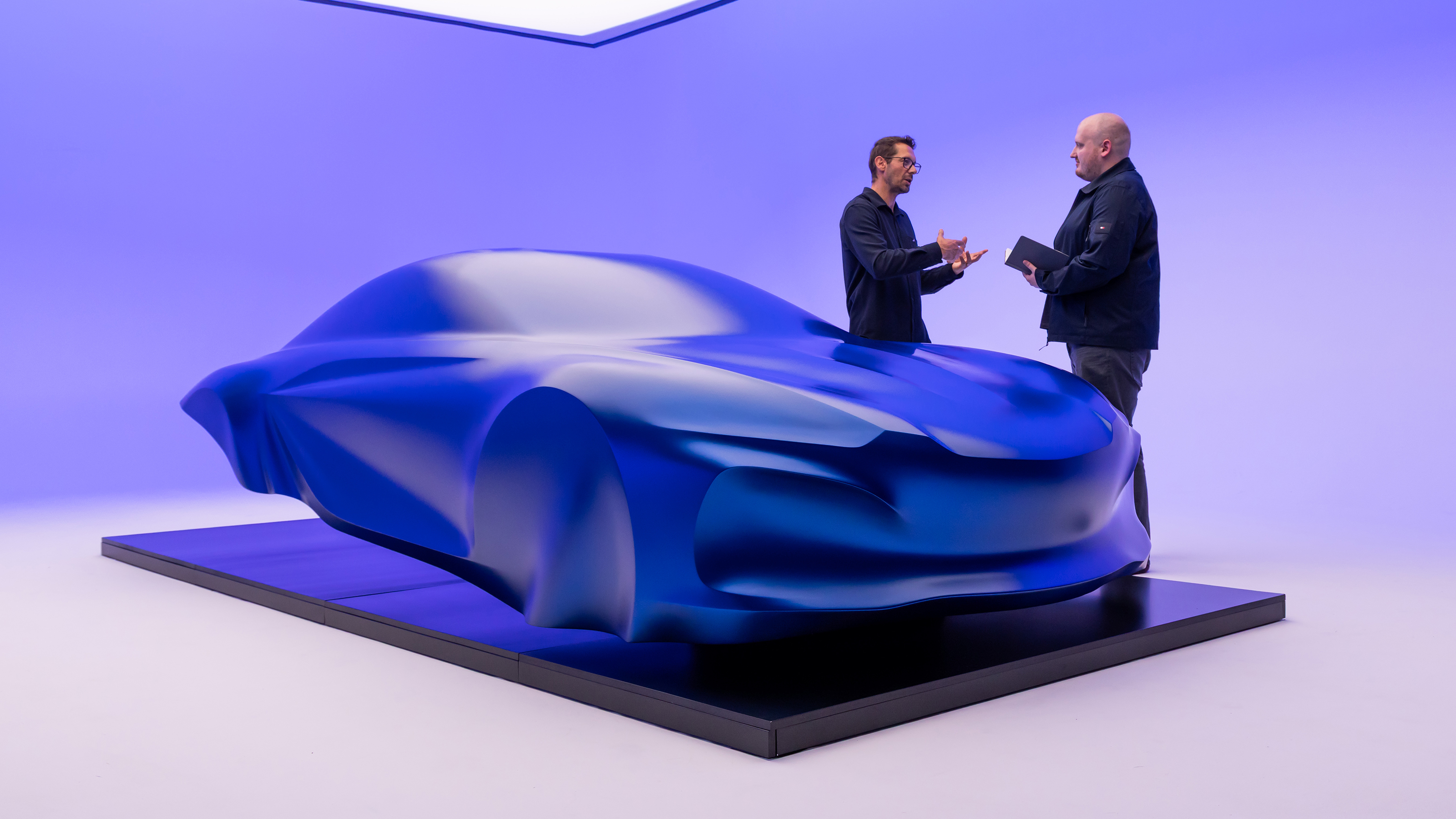 Alpine A110 EV sculpture - Auto Express news reporter Ellis Hyde speaking to Antony Villain, designer, front 