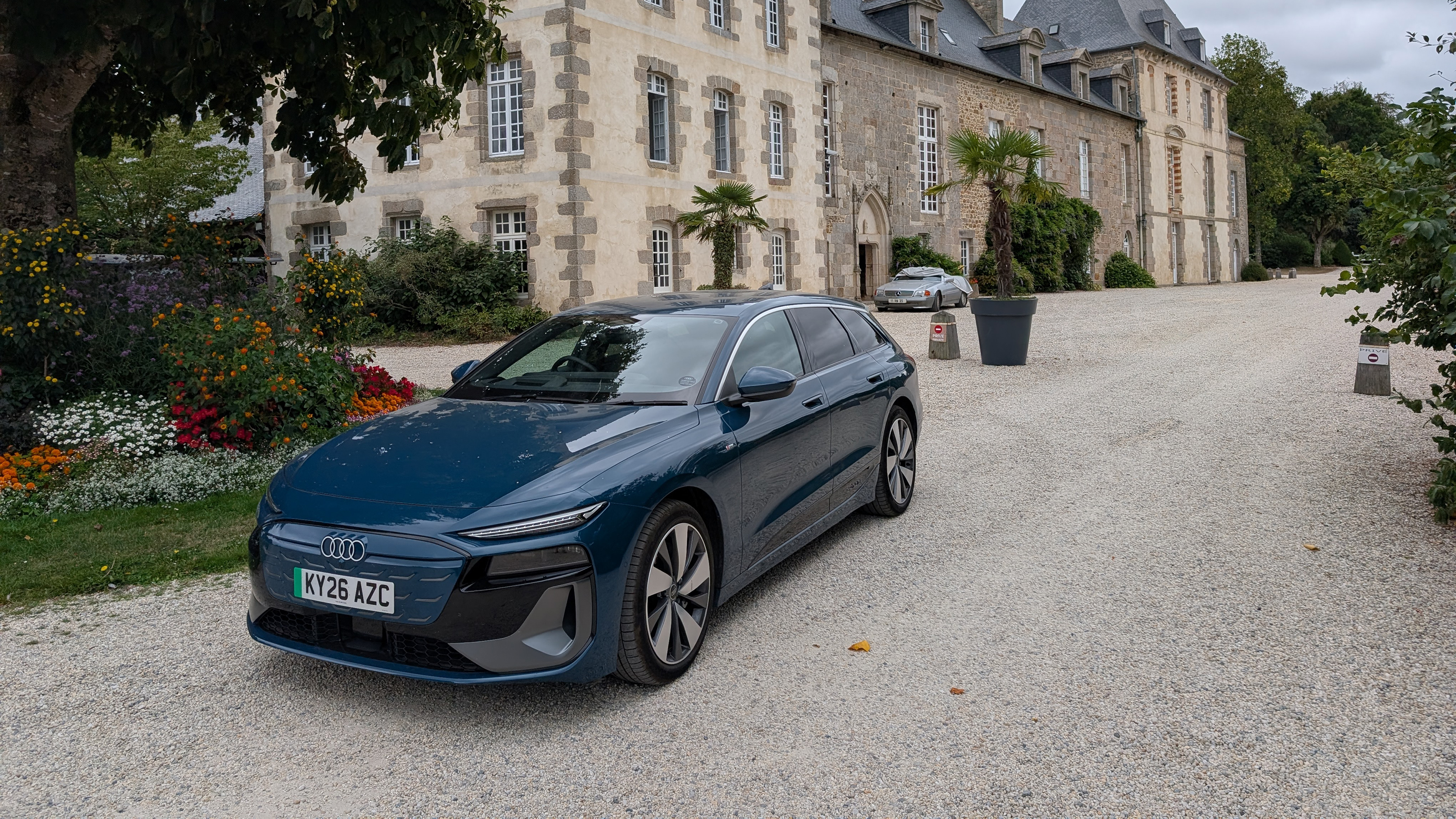Audi A6 Avant e-tron parked outside a French chateau 