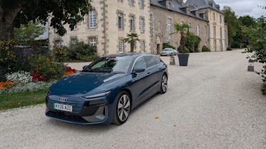 Audi A6 Avant e-tron parked outside a French chateau