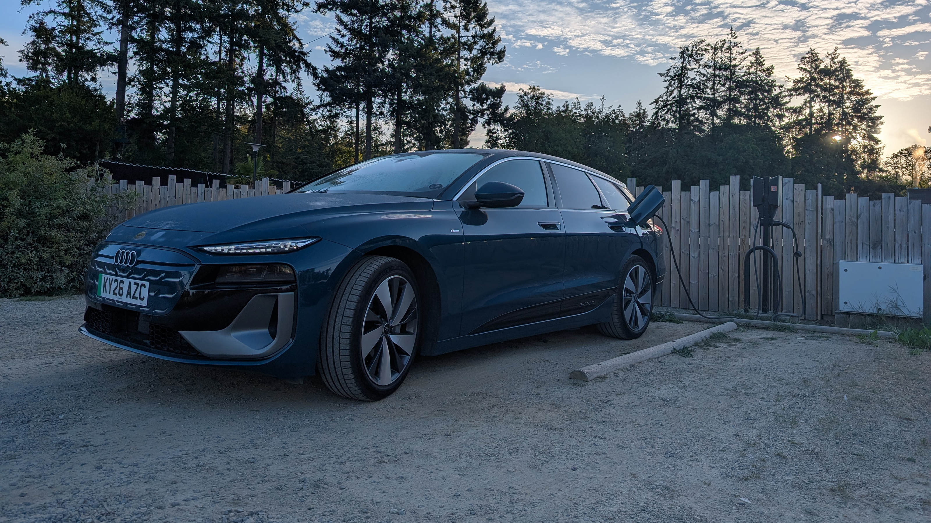 Audi A6 Avant e-tron connected to an EV charger