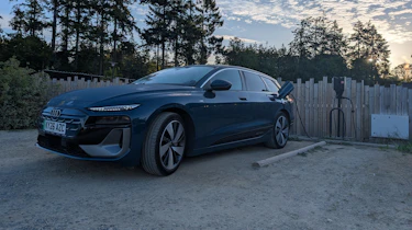 Audi A6 Avant e-tron connected to an EV charger