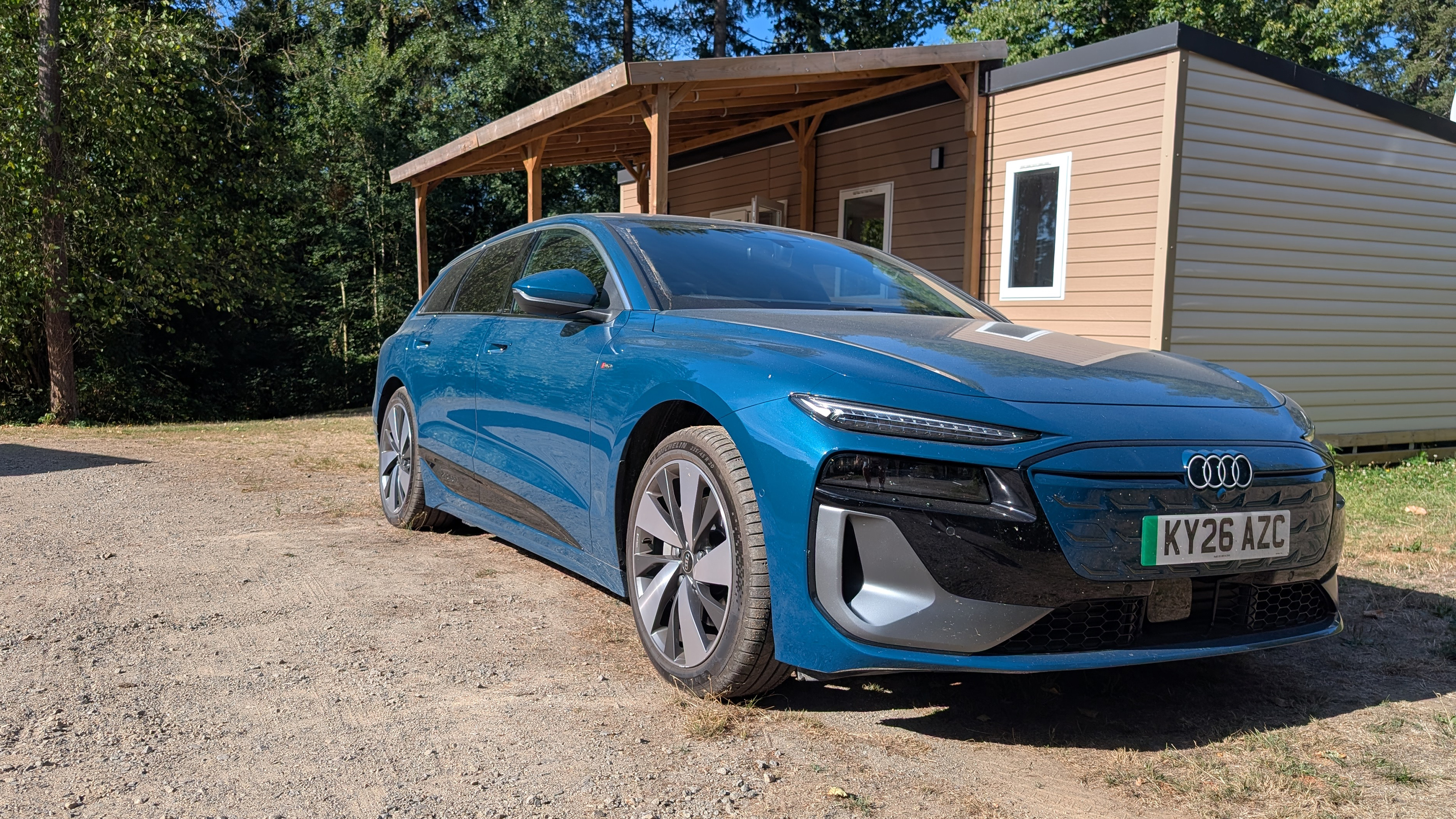 Audi A6 Avant e-tron parked outside a French holiday lodge