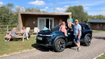 Auto Express creative director Darren Wilson and his family standing by the Dacia Bigster
