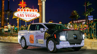 Ford Fathom prototype driving past the Las Vegas sign