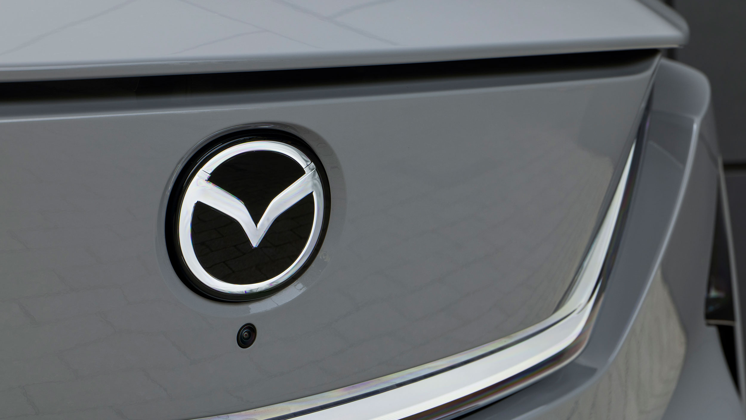 Mazda CX-6e - Mazda badge